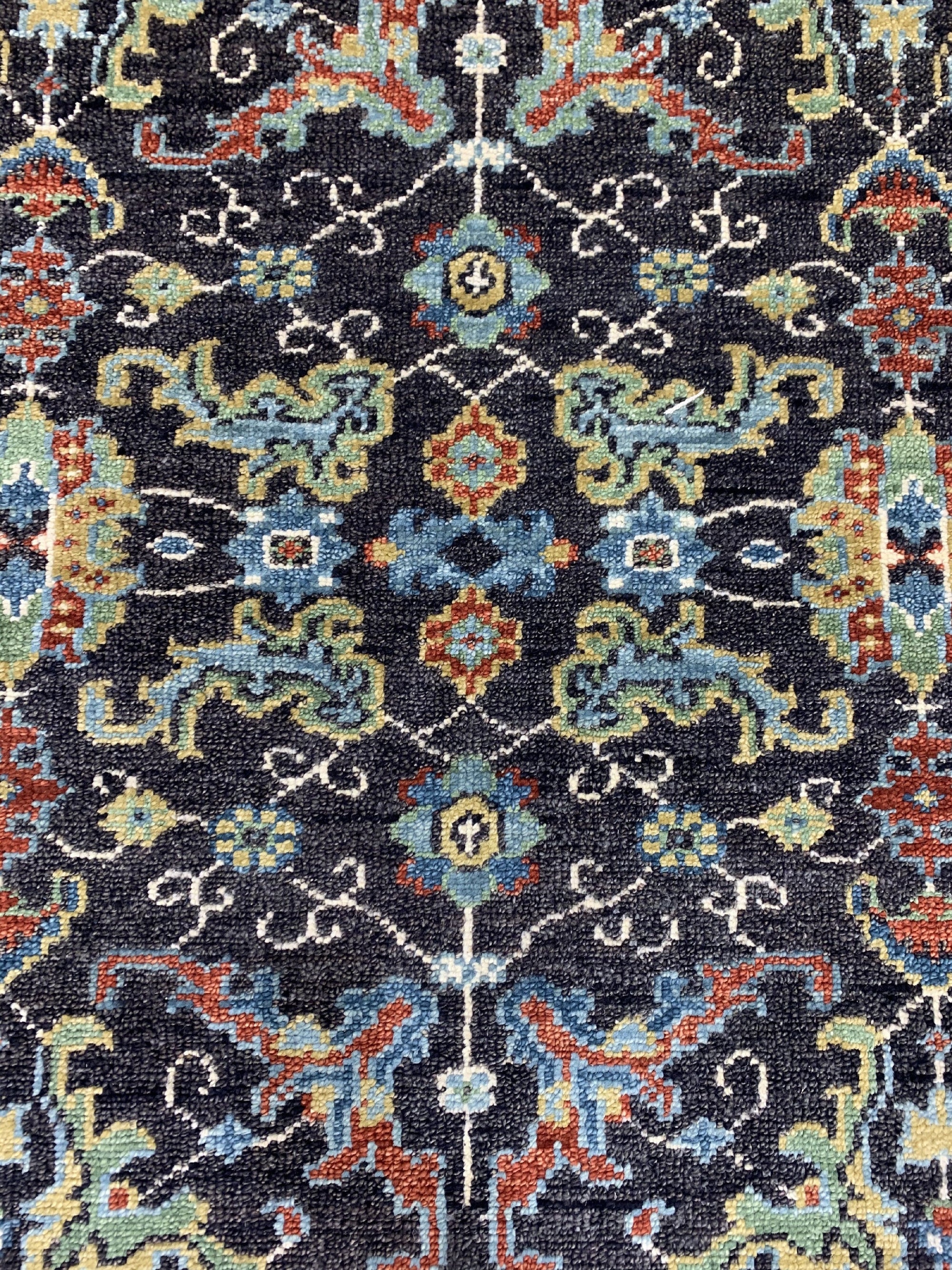 Delicate Oriental Brown Hand Knotted Wool Rug, rich browns and intricate floral patterns grace this hand-knotted wool rug, displayed in a home setting enhancing the room's warmth.