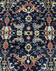 Chloe Oriental Navy Hand Knotted Wool Rug, rich navy tones and intricate oriental patterns grace this hand-knotted wool rug, displayed in a well-lit interior setting.