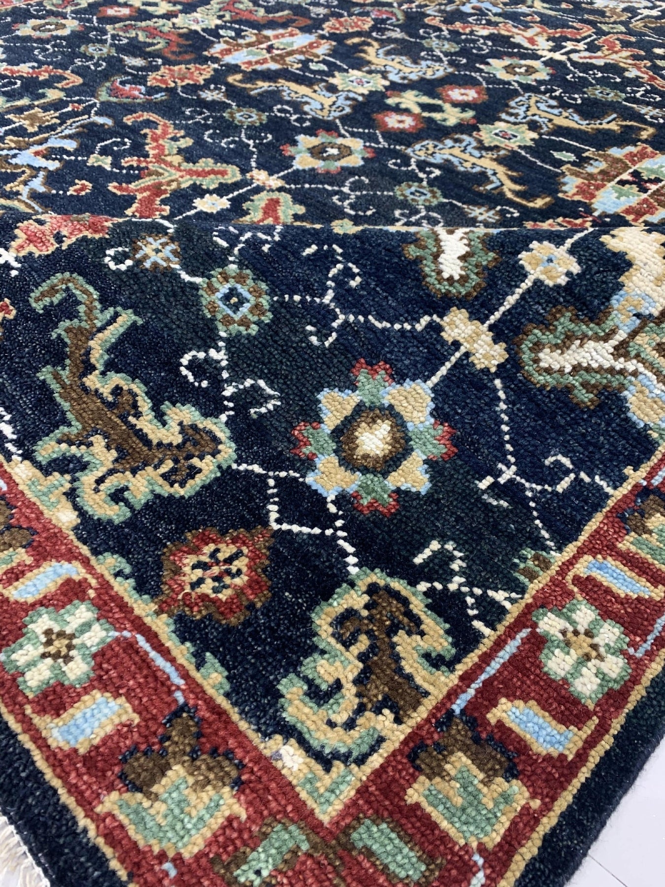 Chloe Oriental Navy Hand Knotted Wool Rug, displaying intricate patterns in deep navy and complementing hues; hand-knotted wool construction offers rich texture and enduring beauty.