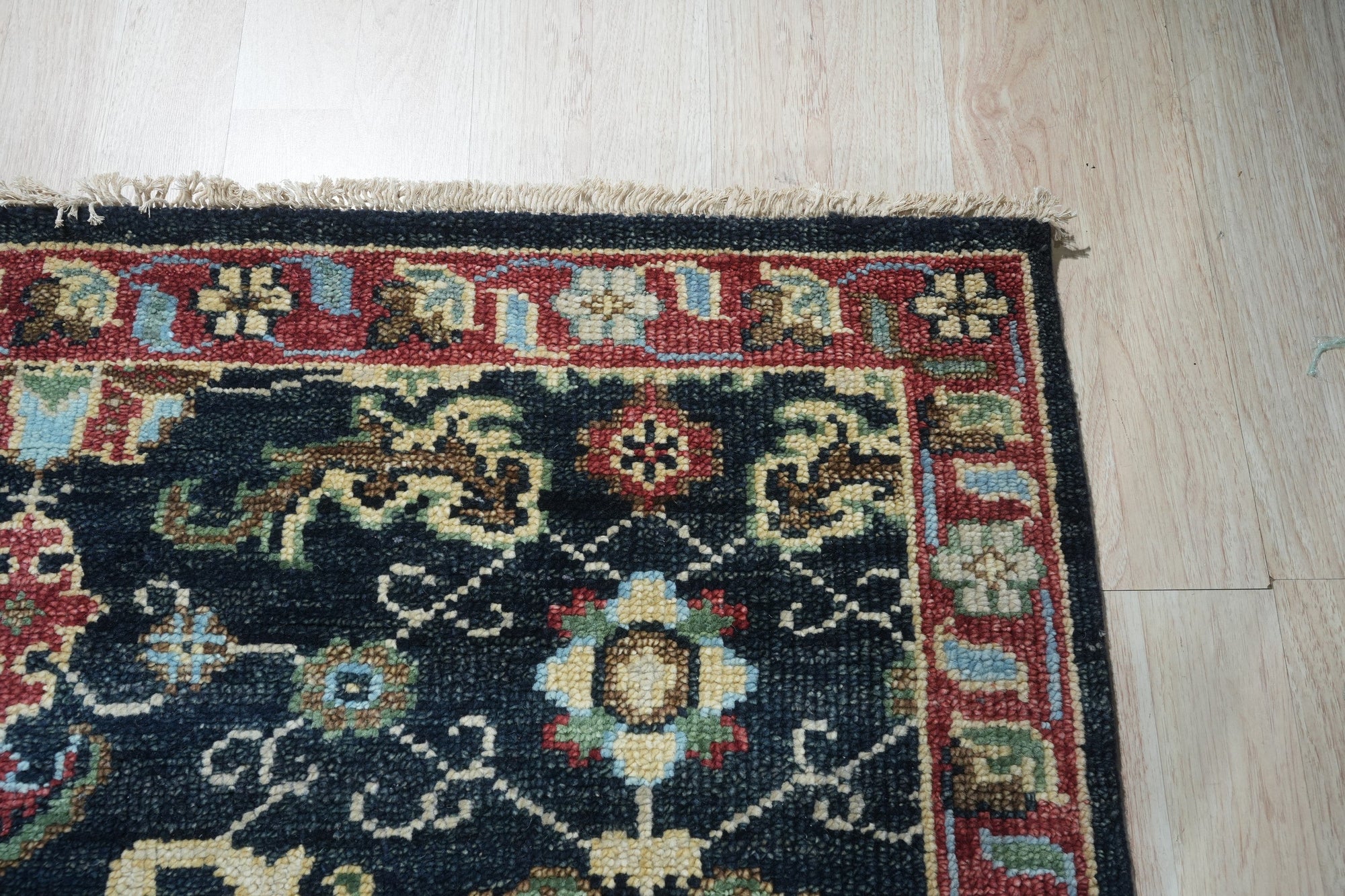 Chloe Oriental Navy Hand Knotted Wool Rug, vibrant navy and cream hues define this hand-knotted wool rug, showcasing a classic oriental design with intricate floral and geometric patterns.