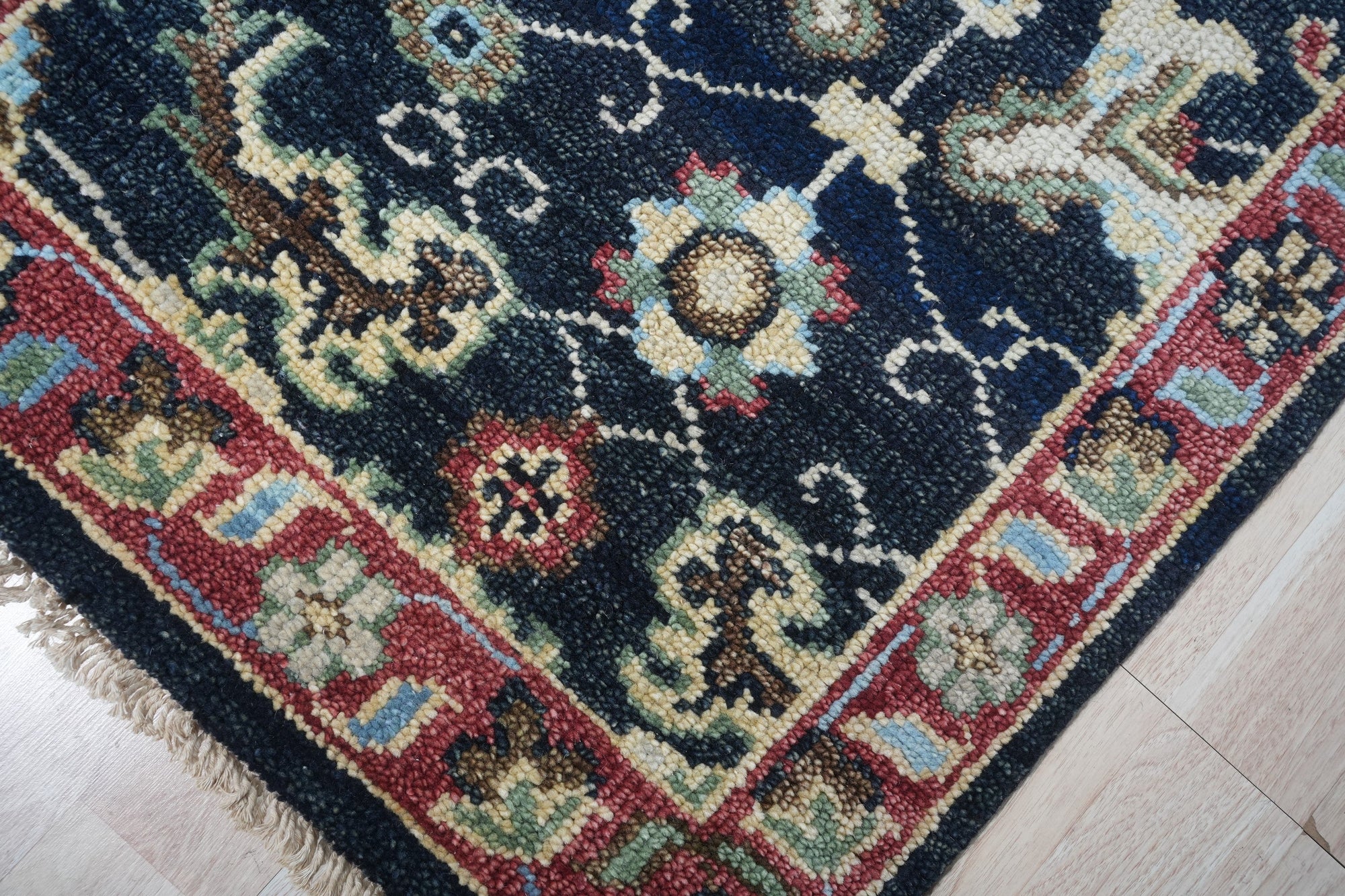 Chloe Oriental Navy Hand Knotted Wool Rug, a navy wool rug with an oriental design, showcasing intricate details and hand-knotted construction.