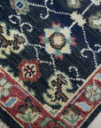 Chloe Oriental Navy Hand Knotted Wool Rug, a navy wool rug with an oriental design, showcasing intricate details and hand-knotted construction.