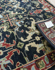 Chloe Oriental Navy Hand Knotted Wool Rug, a hand-knotted wool rug in deep navy with intricate oriental patterns, elegantly displayed.