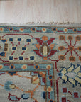 Iris Oushak Beige Hand Knotted Wool Rug, its warm beige tones and intricate Oushak design gracing a thoughtfully styled room.
