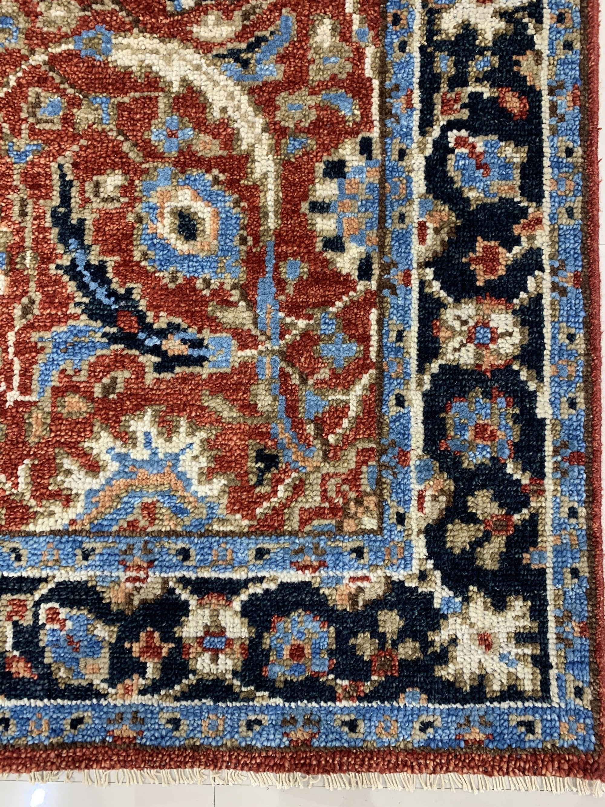 Rustic Oriental Red Hand Knotted Wool Rug, its intricate design and rich red hues providing warmth and texture to a modern living space.