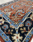 Rustic Oriental Red Hand Knotted Wool Rug, vibrant reds and earthy tones blend in a traditional Oriental pattern. Hand-knotted wool creates depth and texture under soft, diffused lighting. Rich colors evoke warmth and comfort.