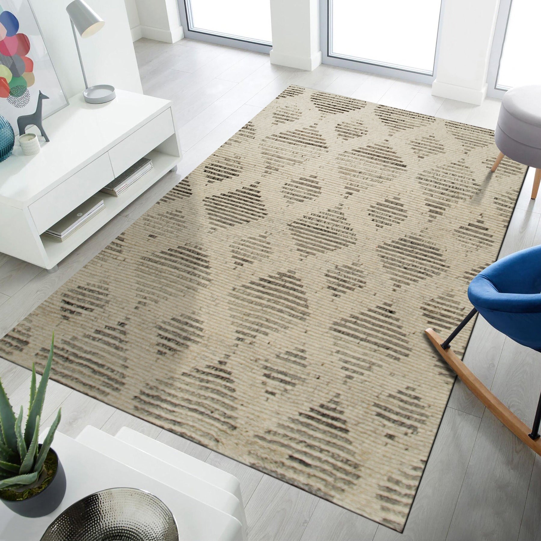 Dazzling Ophelia Beige Hand Knotted Wool Rug, soft beige tones and intricate hand-knotted details create a luxurious texture, seen accentuating a light-filled living space.