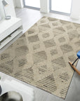 Dazzling Ophelia Beige Hand Knotted Wool Rug, soft beige tones and intricate hand-knotted details create a luxurious texture, seen accentuating a light-filled living space.