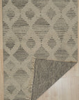 Dazzling Ophelia Beige Hand Knotted Wool Rug, a beige wool rug with intricate hand-knotted detailing, displayed within a room setting.