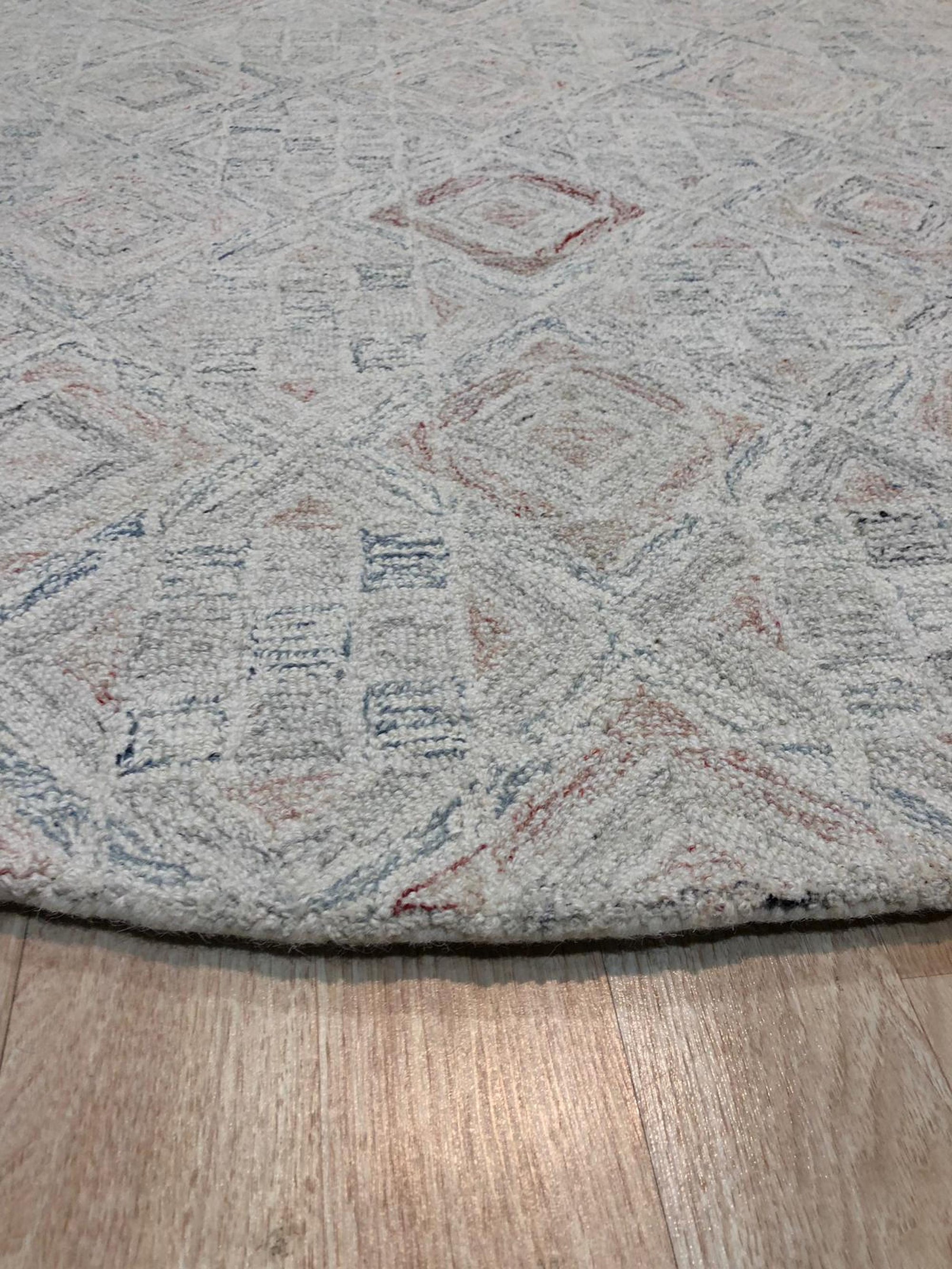 Amara Nina Multicolor Hand Tufted Wool Rug, vibrant threads dance across a textured surface, creating a lively abstract pattern in a contemporary living space.