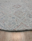 Amara Nina Multicolor Hand Tufted Wool Rug, vibrant threads dance across a textured surface, creating a lively abstract pattern in a contemporary living space.