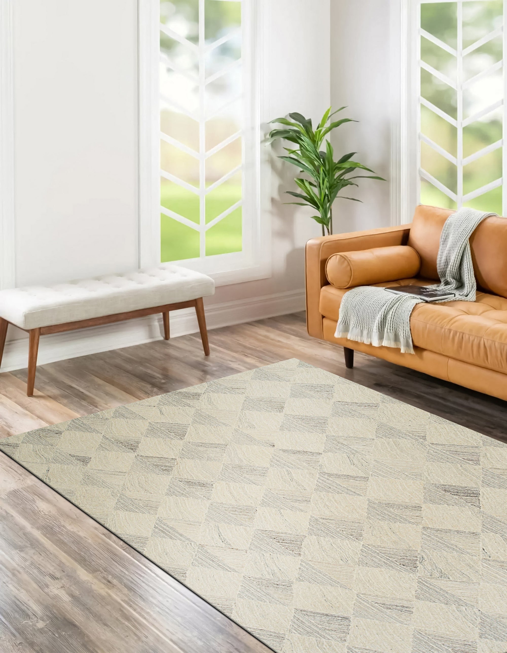 Warm Harlow Gray Hand Tufted Wool Rug, a warm gray wool rug with a subtle, textured pattern, nestled in a living room setting, adding understated elegance to the space.