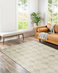 Warm Harlow Gray Hand Tufted Wool Rug, a warm gray wool rug with a subtle, textured pattern, nestled in a living room setting, adding understated elegance to the space.