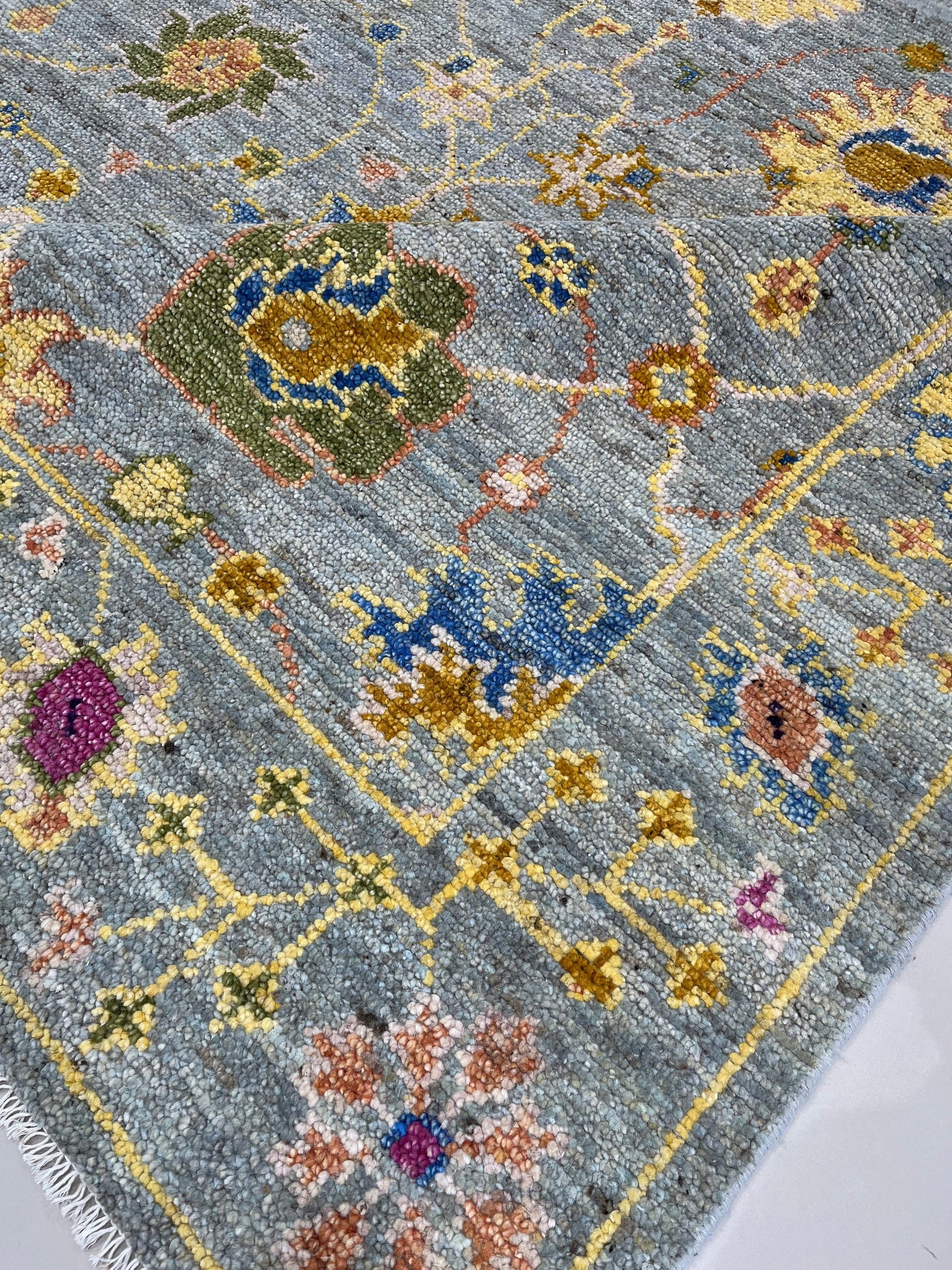 Fiona Oriental Gray Hand Knotted Wool Rug, showcasing intricate, timeless patterns in soft grays, anchoring a contemporary living space with subtle elegance.