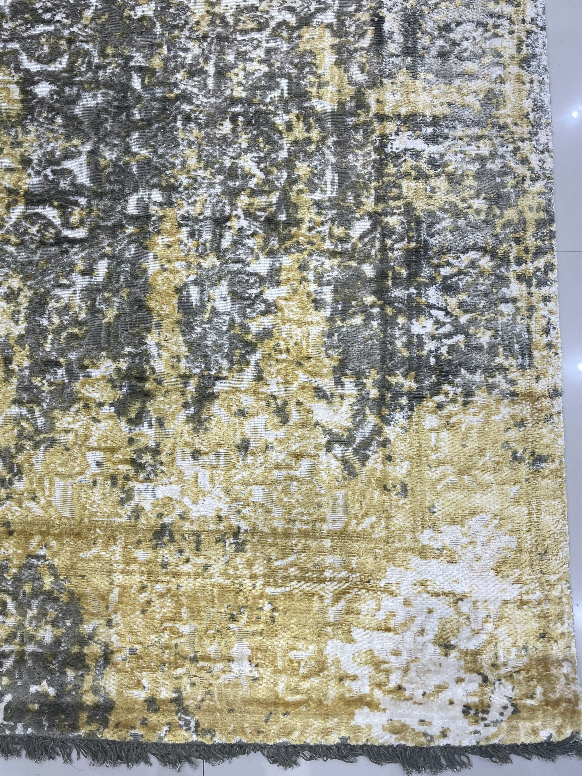 Chic Iris Gold Hand Knotted Wool Rug, featuring a warm gold palette and hand-knotted wool construction, displayed in a bright, modern living space.