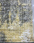 Chic Iris Gold Hand Knotted Wool Rug, featuring a warm gold palette and hand-knotted wool construction, displayed in a bright, modern living space.