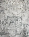 Sarrah Penelope Gray Hand Knotted Wool Rug, features subtle variations in light and dark gray wool yarns, displaying its hand-knotted construction and creating a calming, textured surface.