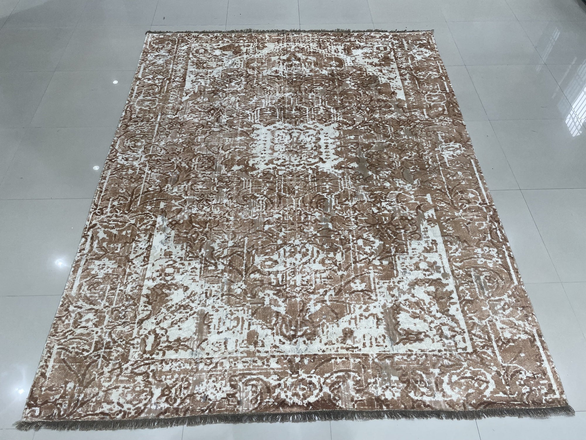 Elegant Versatile Coral Hand Knotted Wool Rug, a warm coral and cream hand-knotted wool rug with a subtle geometric design, displayed in a bright, modern living room setting.