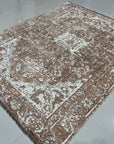 Elegant Versatile Coral Hand Knotted Wool Rug, displaying a subtly textured surface of blended coral and cream hues, the hand-knotted wool construction adding depth and a soft, inviting feel to the abstract design, seen in a lifestyle setting.