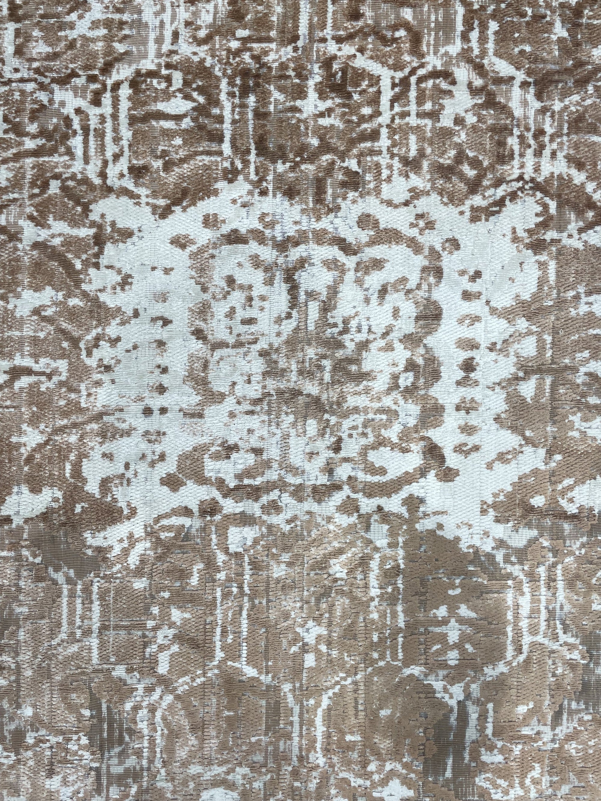 Elegant Versatile Coral Hand Knotted Wool Rug, bathed in warm light, shows off its coral hues and intricate hand-knotted texture, displayed in a cozy interior setting.