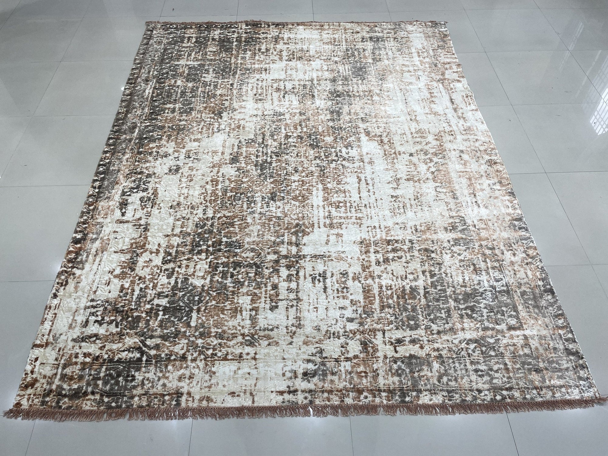 Brenda Isla Coral Hand Knotted Wool Rug, displaying vibrant coral hues and intricate hand-knotted detail, presented in a styled interior setting.