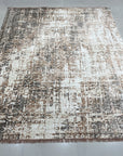 Brenda Isla Coral Hand Knotted Wool Rug, displaying vibrant coral hues and intricate hand-knotted detail, presented in a styled interior setting.