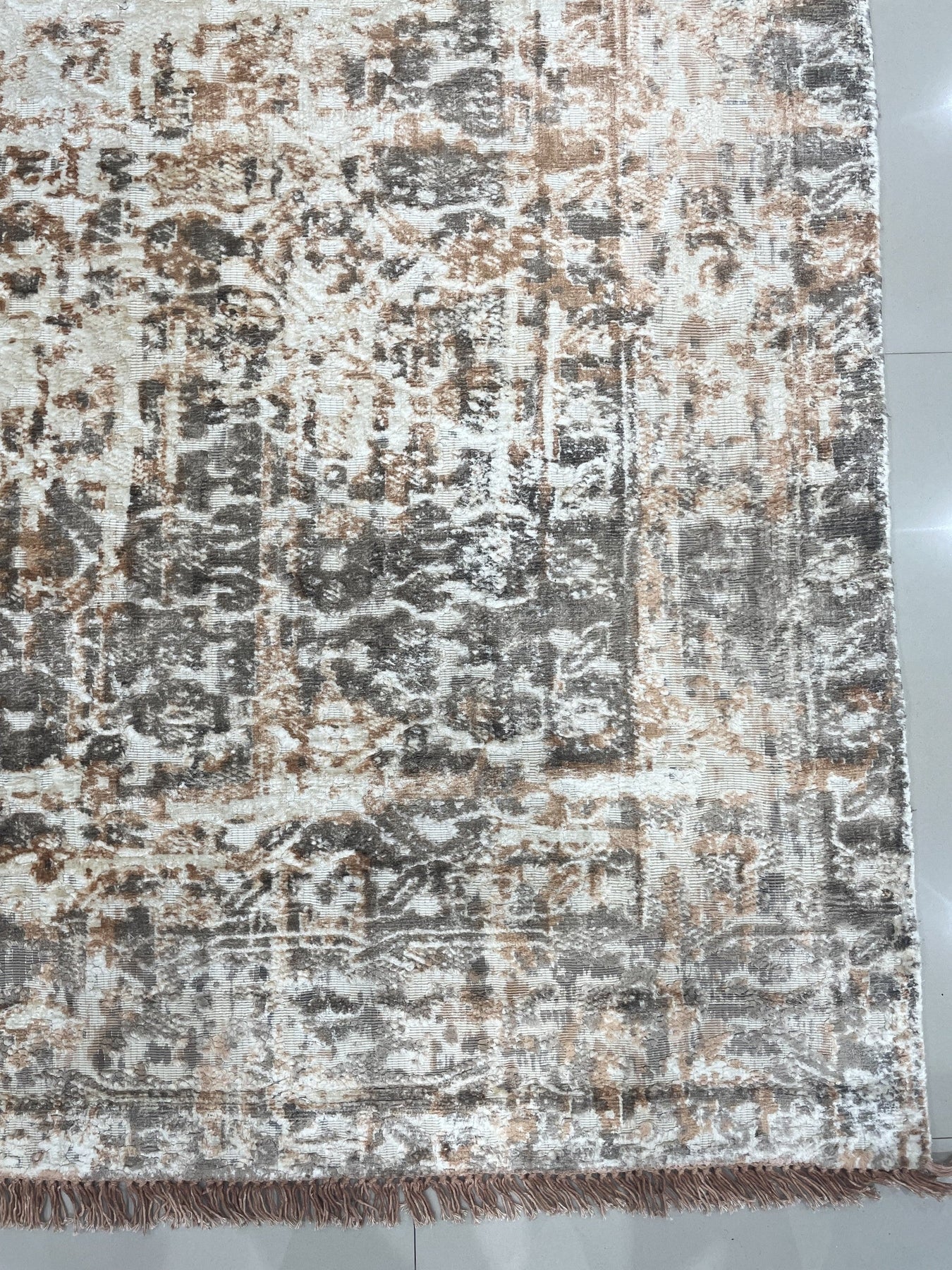 Brenda Isla Coral Hand Knotted Wool Rug, showcasing a soft, coral palette with subtle variations in tone, its hand-knotted construction evident in the dense, luxurious pile, creating a warm and inviting atmosphere within the room setting.