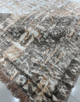 Brenda Isla Coral Hand Knotted Wool Rug, textural waves of coral hues ripple across a hand-knotted wool surface, grounding a bright, modern living space.