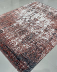 Ava Dahlia Red Hand Knotted Wool Rug, vibrant red and intricately patterned, laying flat with detailed floral motifs visible, showcasing its hand-knotted construction and luxurious texture.