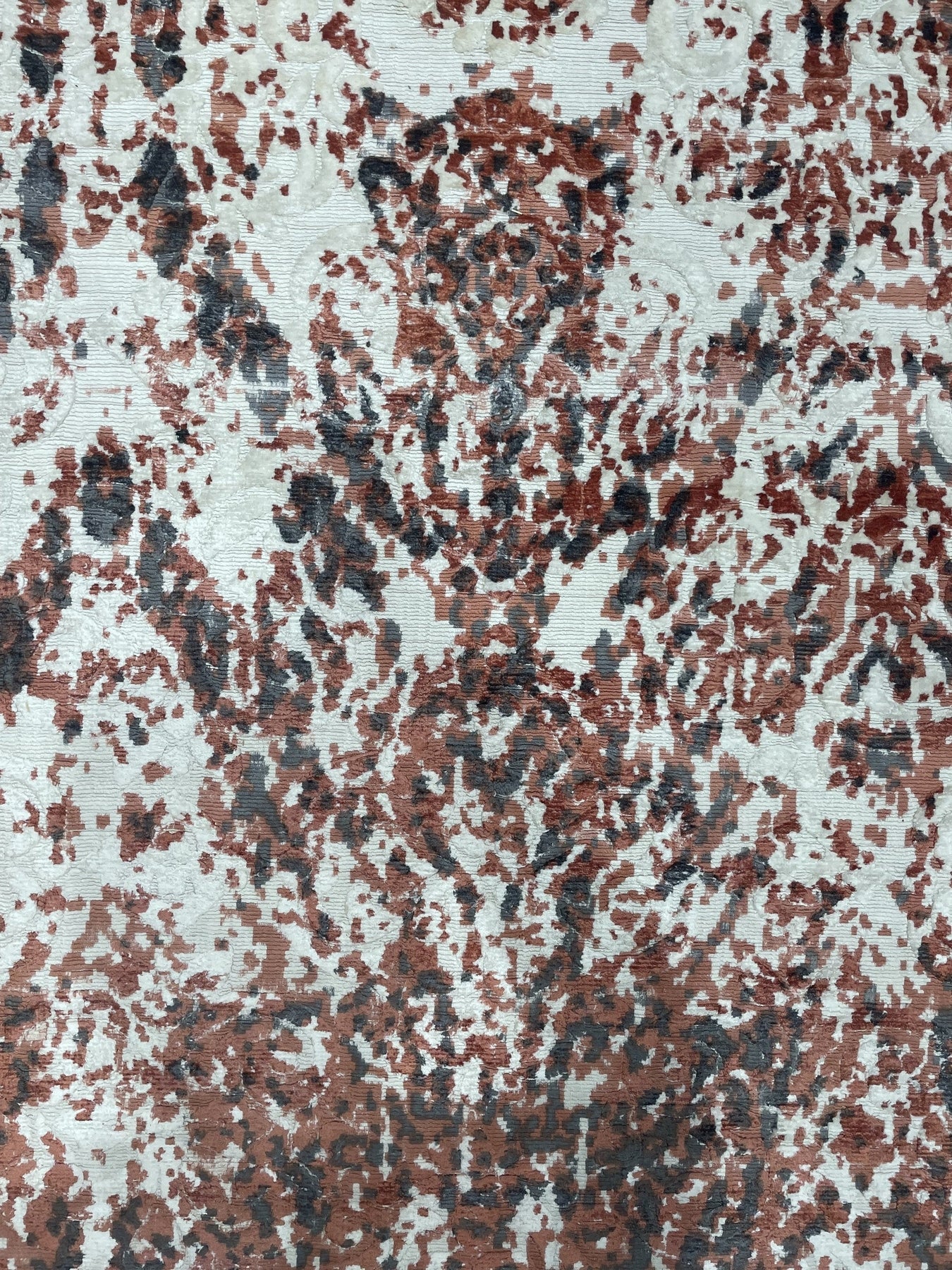 Ava Dahlia Red Hand Knotted Wool Rug, vibrant red wool adding warmth to a well-lit living room. The hand-knotted construction displays intricate dahlia patterns.