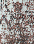 Ava Dahlia Red Hand Knotted Wool Rug, vibrant red wool adding warmth to a well-lit living room. The hand-knotted construction displays intricate dahlia patterns.
