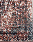 Ava Dahlia Red Hand Knotted Wool Rug, its vibrant red hues and intricate dahlia-inspired design anchoring a stylish living room.