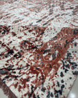 Ava Dahlia Red Hand Knotted Wool Rug, featuring a vibrant red floral pattern hand-knotted from wool, presented in a room setting with furniture.