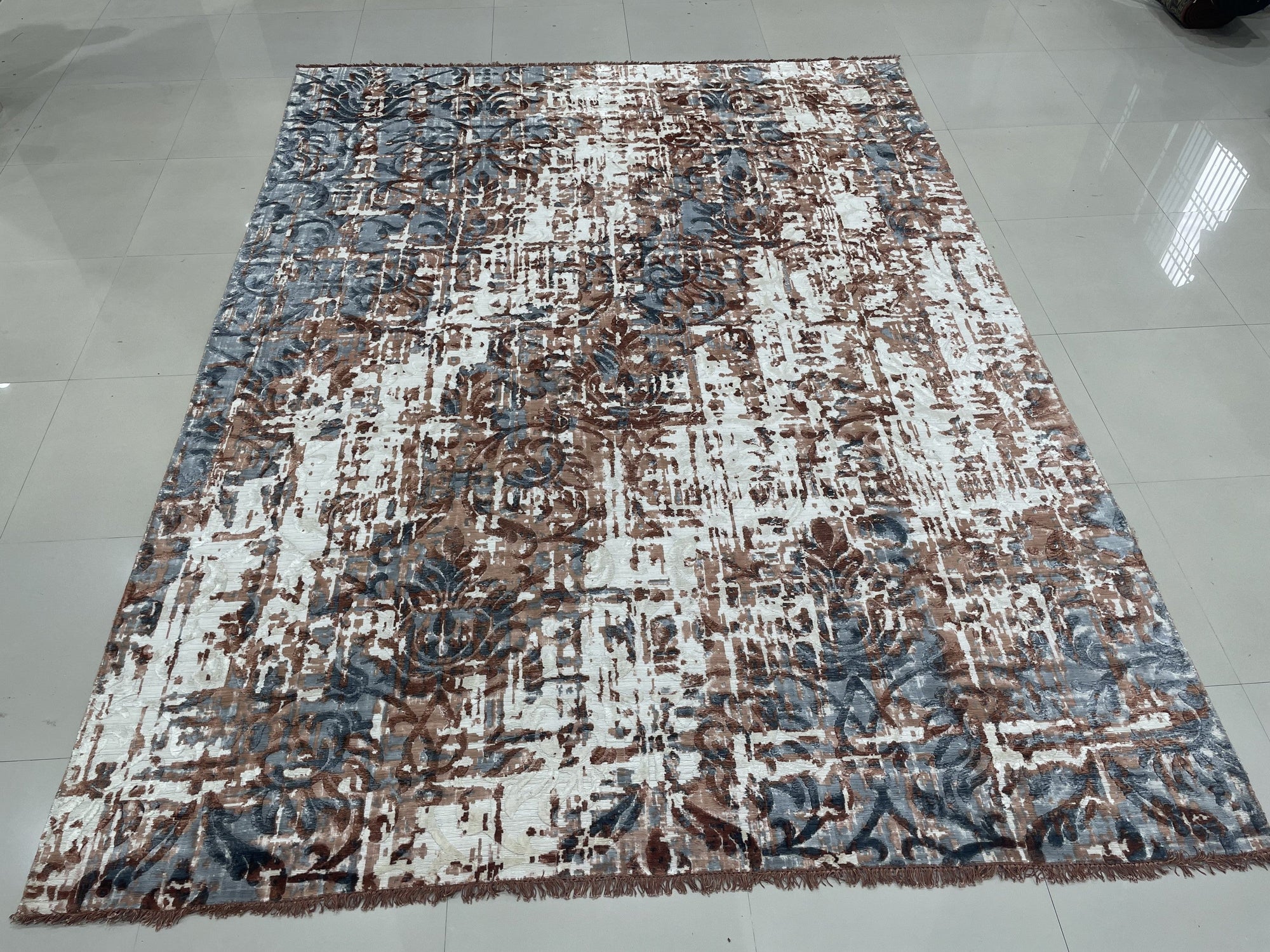 Charming Modern Coral Hand Knotted Wool Rug, a warm coral and ivory wool rug with a contemporary geometric pattern, staged in a bright, modern living room setting.