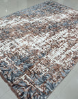 Charming Modern Coral Hand Knotted Wool Rug, soft coral hues and subtle modern design details come alive in a detail shot highlighting the hand-knotted construction and wool texture.