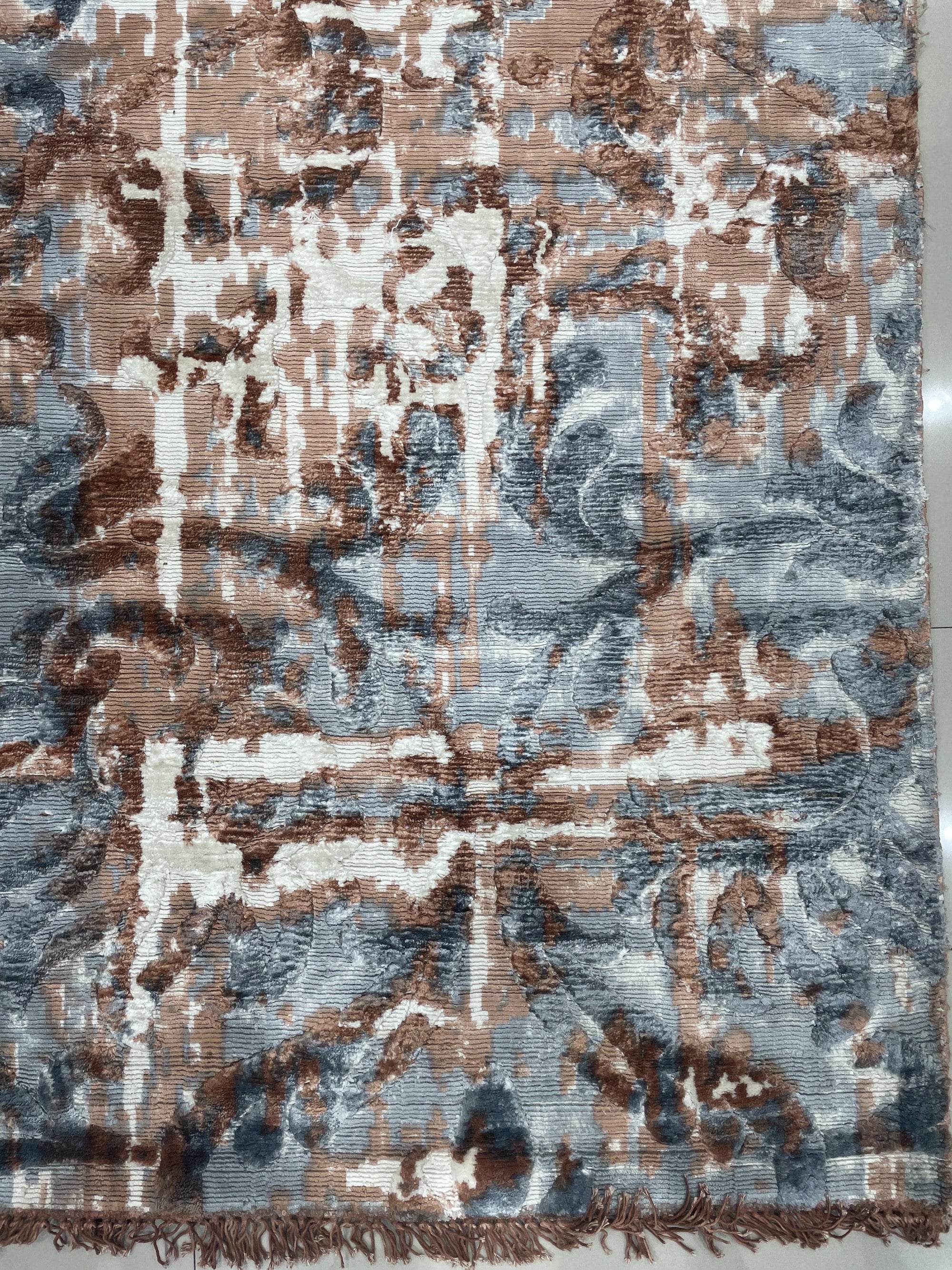 Charming Modern Coral Hand Knotted Wool Rug, its vibrant coral hues and hand-knotted texture radiating warmth in a sunlit living space.