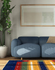 Beautiful Gabbeh Navy Handmade Wool Rug, displayed on a light wood floor, features a deep navy field punctuated by minimalist geometric shapes and abrash variations indicative of hand-spun wool.