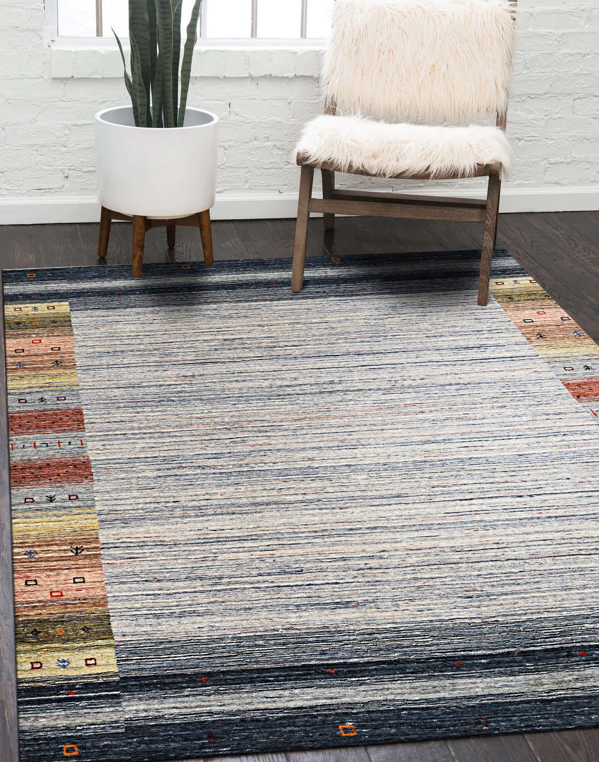 Chic Gabbeh Gray Handmade Wool Rug, soft gray tones and subtly textured wool creating a warm, inviting atmosphere on hardwood flooring.