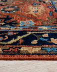 Elegant Traditional Rust Hand Knotted Wool Rug, a richly textured wool rug with intricate traditional patterns in warm rust and muted tones, displayed in a bright, modern living space.