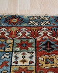 Mira Traditional Red Hand Knotted Wool Rug, vibrant reds and intricate patterns create a warm and inviting space; hand-knotted wool construction provides both beauty and durability.