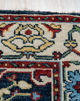 Enchanting Traditional Navy Hand Knotted Wool Rug, a navy wool rug with intricate traditional patterns, displayed in a bright, modern living room setting.