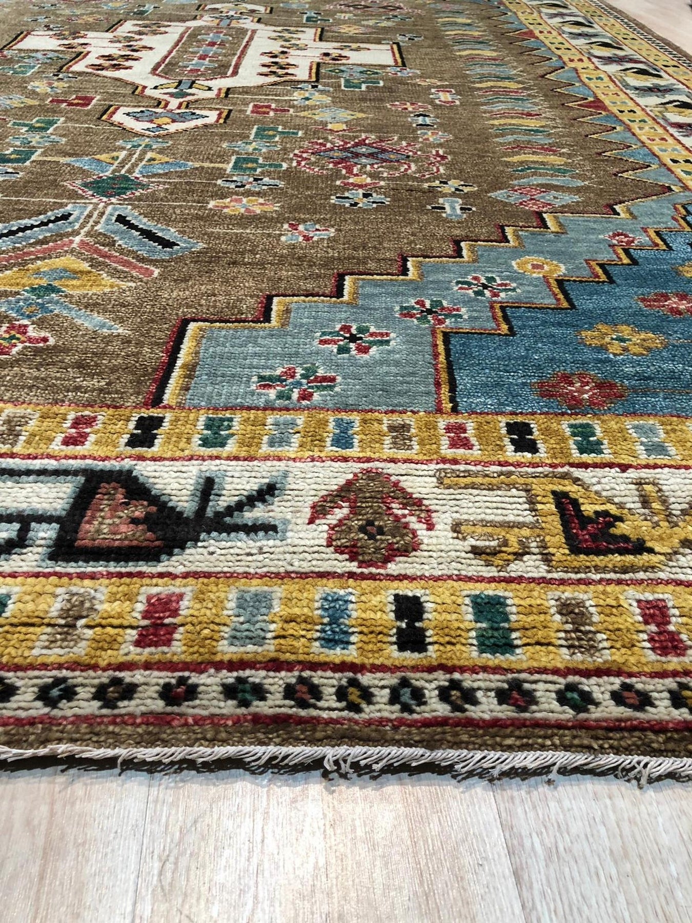 Classic Dazzling Brown Hand Knotted Wool Rug, a rich brown wool rug with intricate knotting, displayed in a bright, modern living room setting.