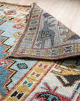 Classic Dazzling Brown Hand Knotted Wool Rug, displaying intricate patterns in warm browns and creams, hand-knotted wool construction evident in its dense pile, seen in a styled home setting.