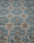 Charming Alluring Gray Hand Knotted Wool Rug displayed on a light hardwood floor, its soft gray hues and hand-knotted texture creating a subtly textured and inviting space.