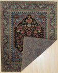 Vibrant Traditional Green Hand Knotted Wool Rug, showcasing a detailed floral pattern in shades of green, cream, and burgundy, lies elegantly on a light hardwood floor, highlighting its texture and craftsmanship.