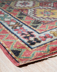 Lydia Kazak Brown Hand Knotted Wool Rug, its warm brown tones and intricate geometric patterns grounding a living space bathed in natural light.