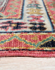 Lydia Kazak Brown Hand Knotted Wool Rug, showcasing its intricate geometric design and warm brown hues. The hand-knotted construction is evident in the luxurious texture.