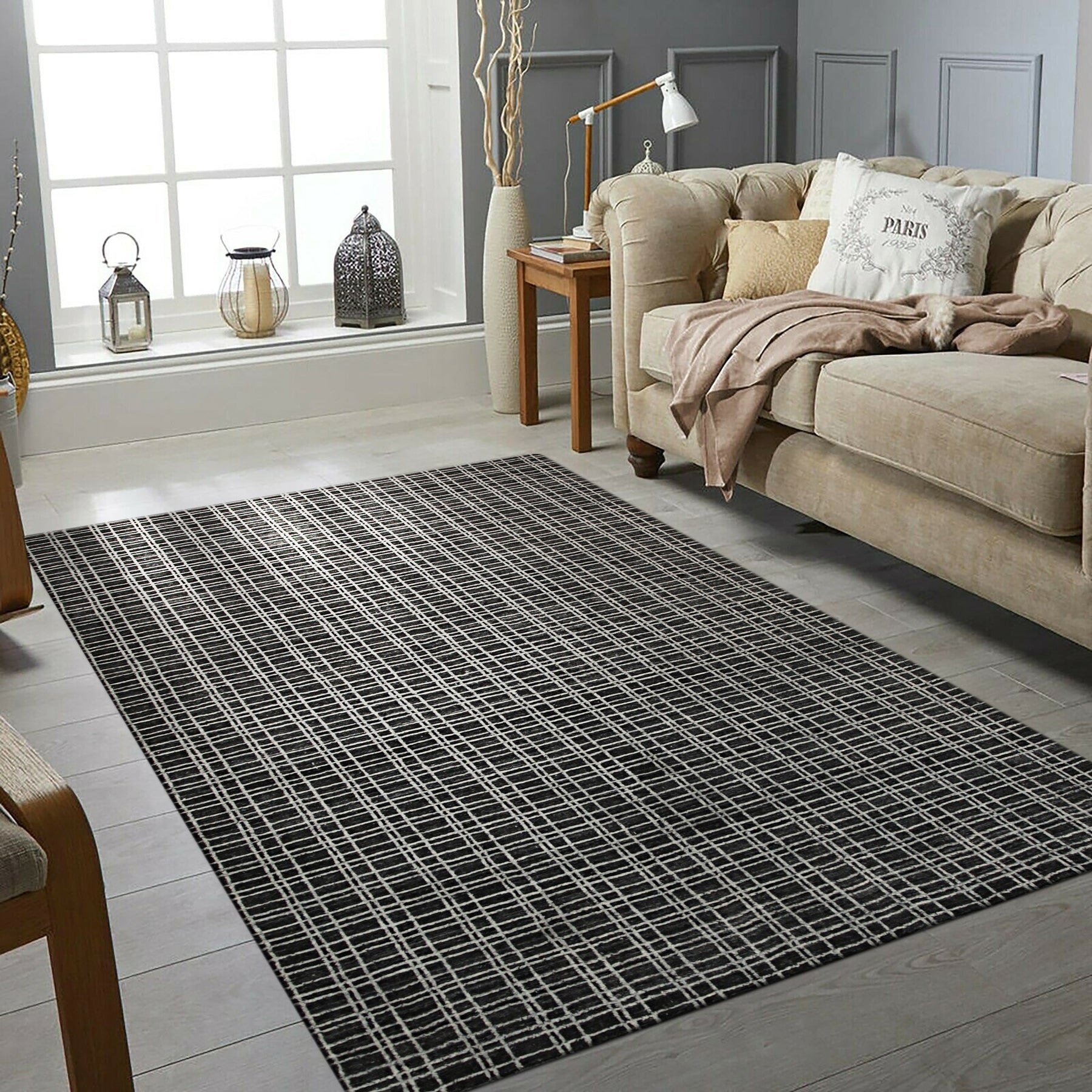 Sumptuous Jade Charcoal Handmade Wool & Viscose Rug, its subtle sheen catching the light in a softly lit room. Textural pile of mixed wool and viscose fibers hints at luxurious comfort underfoot, its jade and charcoal tones creating a sophisticated, calming atmosphere.