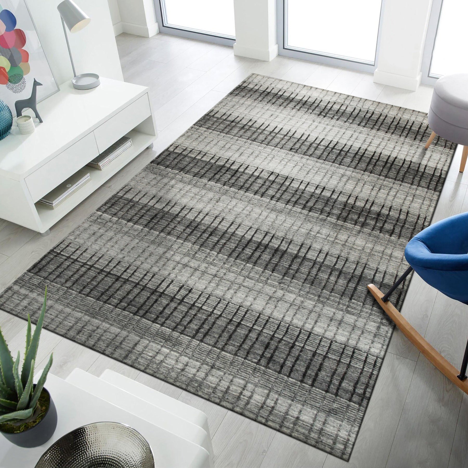 Comfortable Modern Gray Hand Knotted Wool & Viscose Rug, its subtle gray tones and hand-knotted texture adding sophisticated comfort to a minimalist living room space.