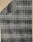 Comfortable Modern Gray Hand Knotted Wool & Viscose Rug, a cool grey and subtly textured rug, anchors a minimalist living room with its hand-knotted elegance.